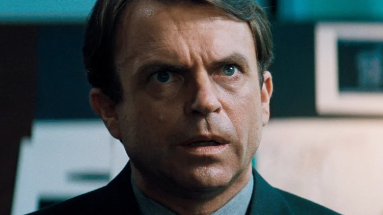 Sam Neill as John Trent looking confounded in In the Mouth of Madness