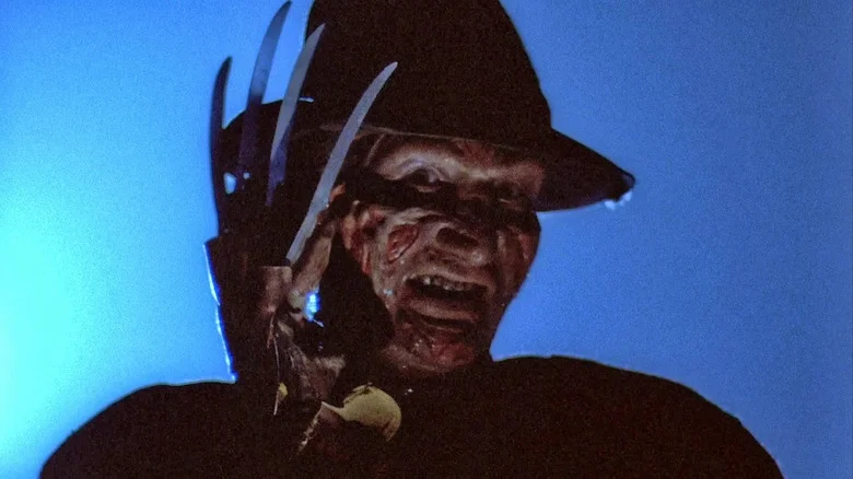 Freddy Krueger looks menacing, glove raised