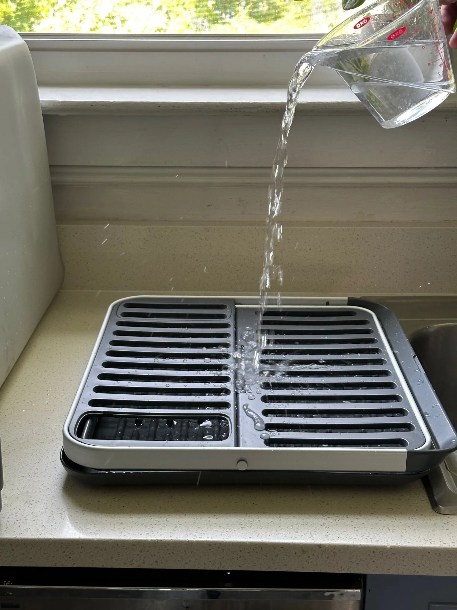 Pouring water on Oxo folding dish rack