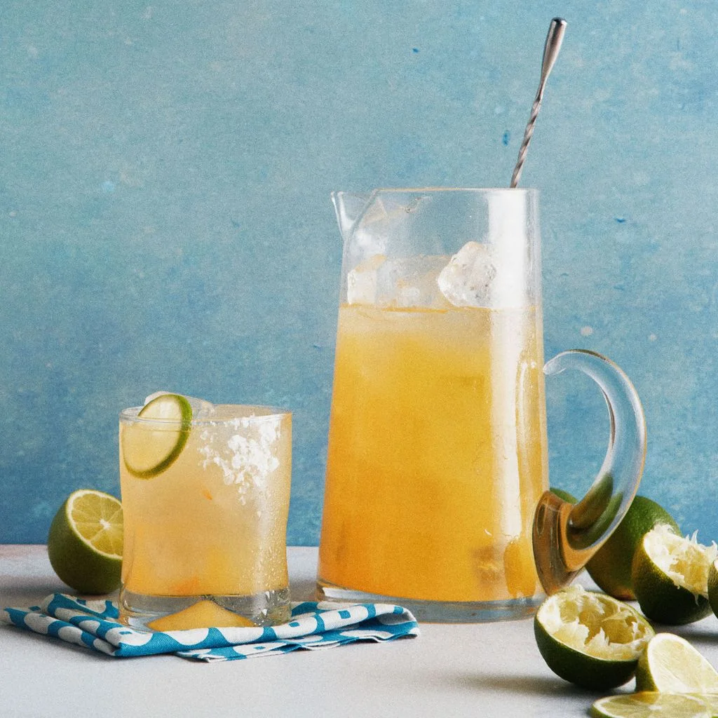 Tangerine juice Patron tequila and Modela Especial in a pitcher of ice and service with lime rounds or wedges and a salt...