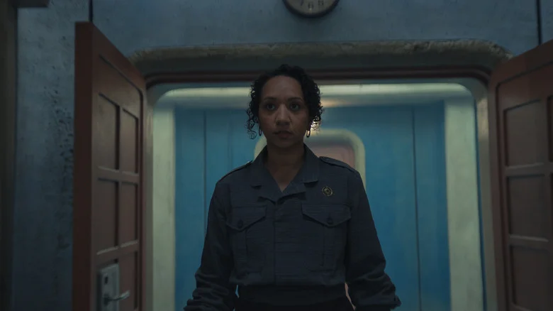 Camille walking into the IT room with the creepy AI voice in Silo