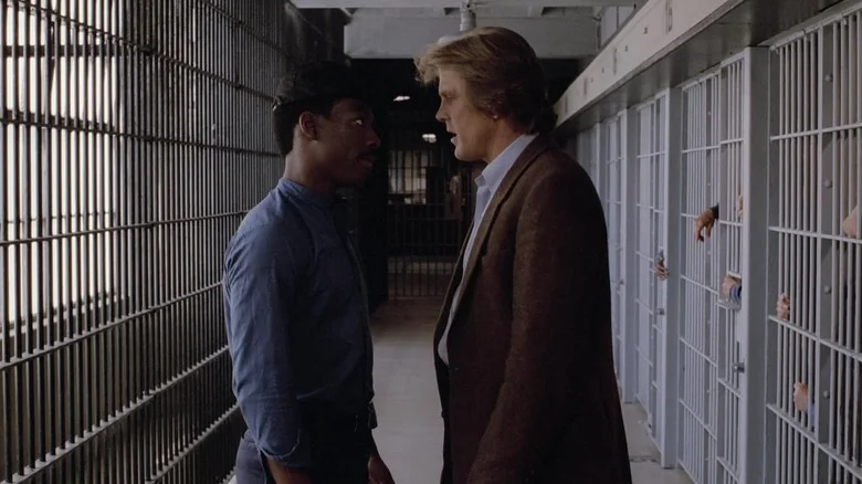 Eddie Murphy as Reggie Hammond and Nick Nolte as Jack Cates square off in a prison in 48 Hours