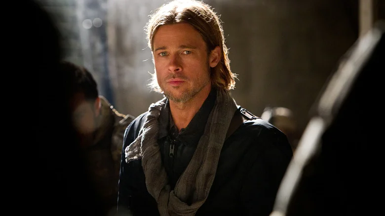 Brad Pitt as Gerry Lane standing in the middle of a crowded street in World War Z