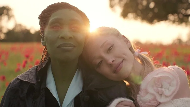 Elphaba and Galinda sitting together happily in Wicked: For Good