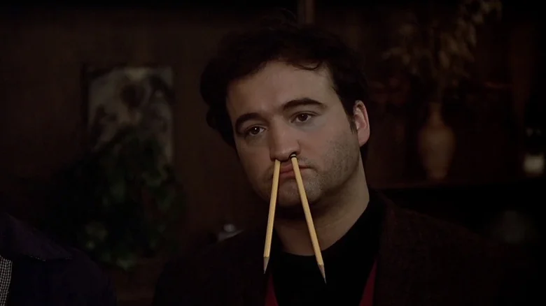 John Belushi as Bluto with pencils in his nose in National Lampoon's Animal House