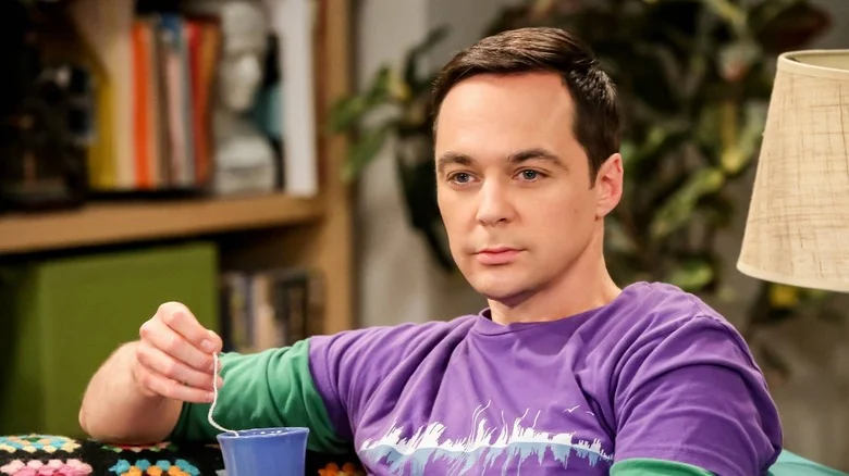 Sheldon holding a cup of tea and staring into the distance on The Big Bang Theory
