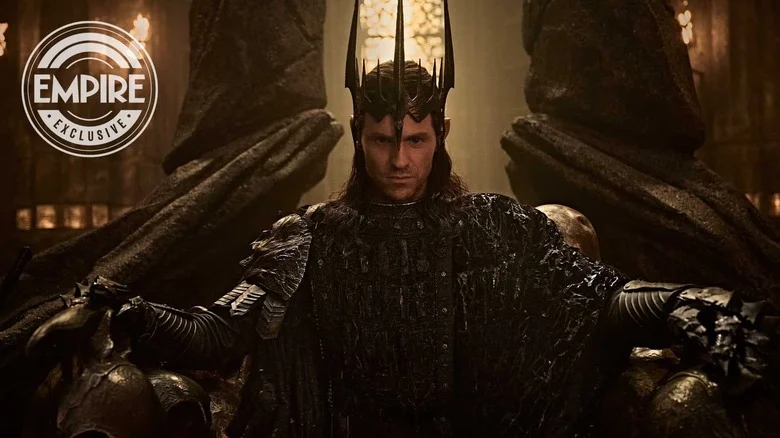 Charlie Vickers as Sauron wearing his crown and seated on a throne in The Lord of the Rings: The Rings of Power