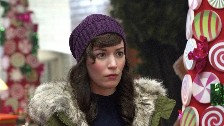 Liz looking startled in a purple hat on Man Seeking Woman
