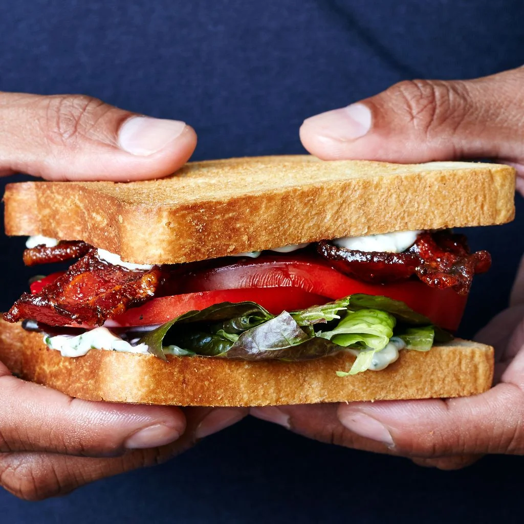 Image may contain Human Person Food Sandwich Burger and Hot Dog