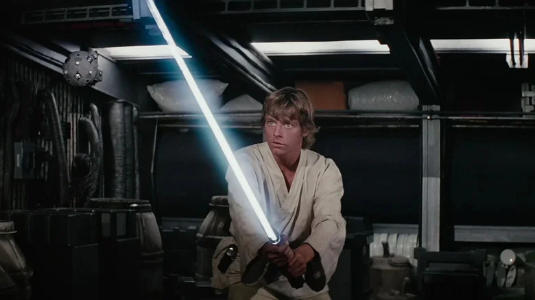 Luke Skywalker holding a lightsaber in Star Wars