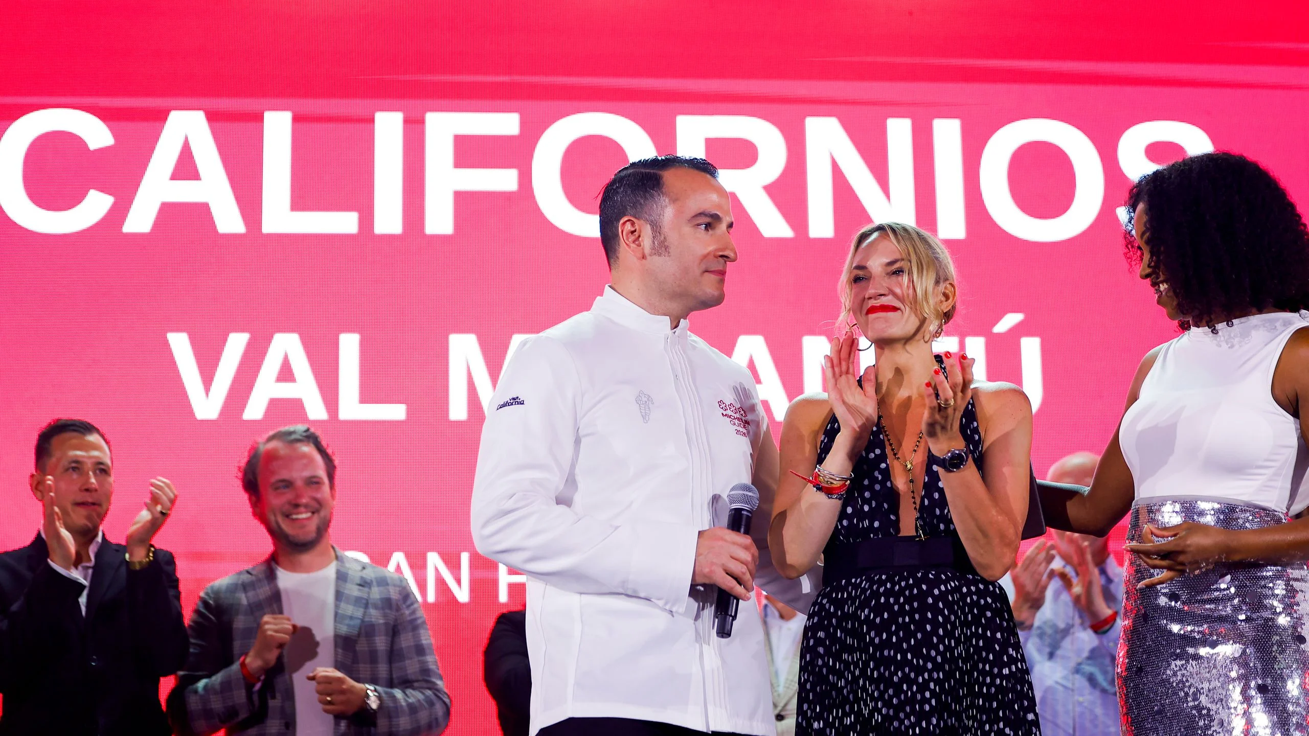 Chef Val M. Cantu left and his wife Carolyn stand on the stage after being awarded threeMichelin Stars during the...