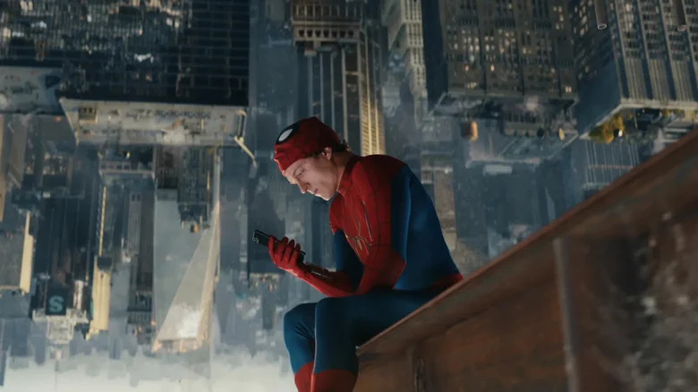 Peter checking his phone in Spider-Man: Brand New Day