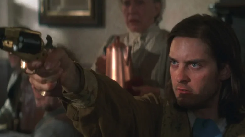 Jake Roedel (Tobey Maguire) points a gun in a diner in Ride with the Devil