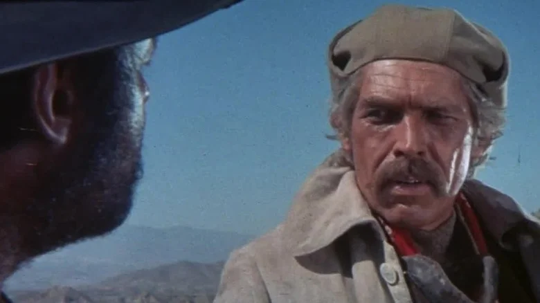 John H. Mallory (James Coburn) glances at Juan Miranda (Rod Steiger) in Duck, You Sucker!