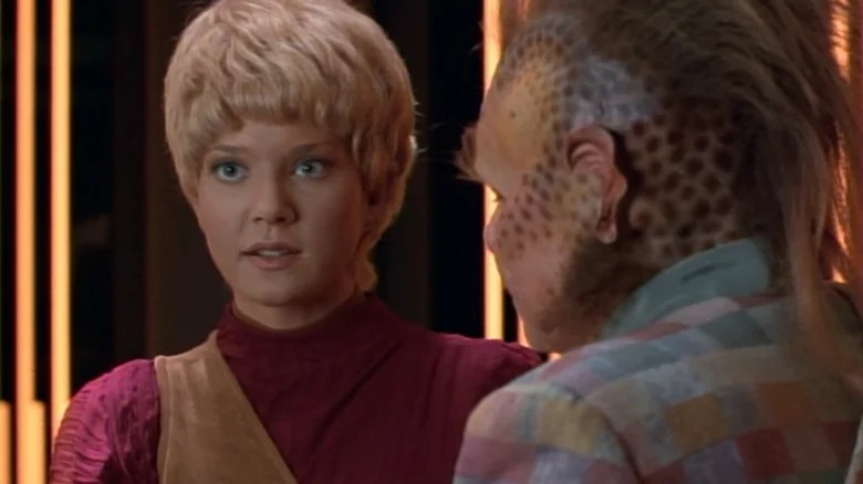 Kes talking while Neelix looks at her on Star Trek: Voyager