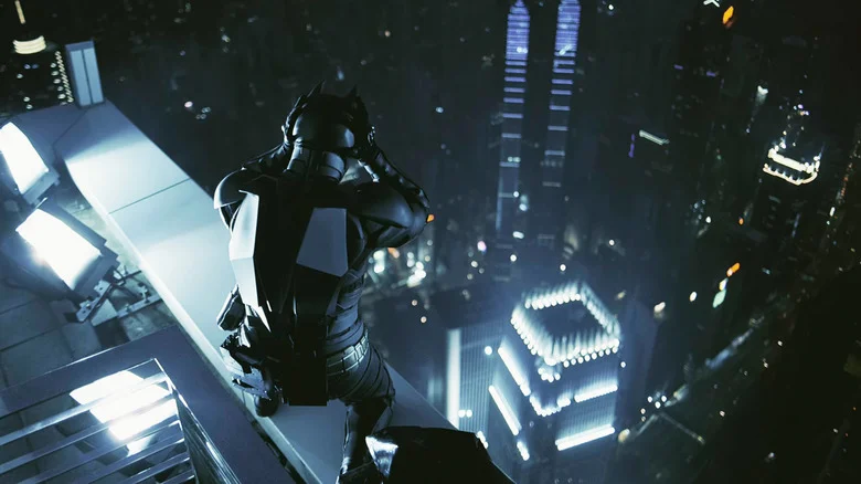 Christian Bale's Batman stands on top of a Hong Kong skyscraper looking down in The Dark Knight