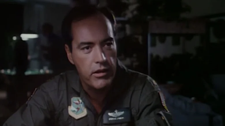 Powers Boothe's Major Cassidy sits in a canteen in By Dawn's Early Light