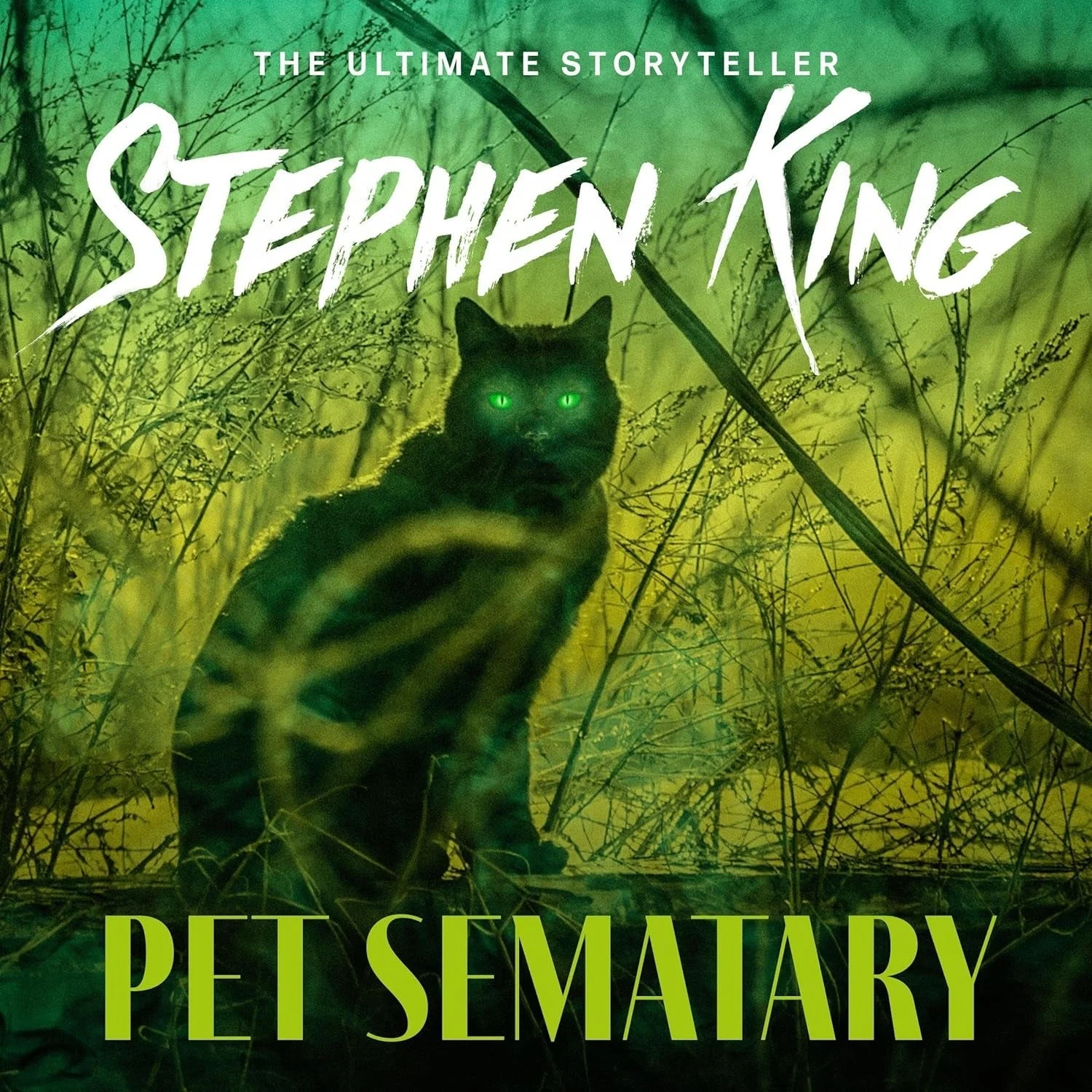 Cover of Stephen King's "Pet Sematary" featuring a black cat with glowing eyes amidst tall grass, with text highlighting King as "The Ultimate Storyteller."
