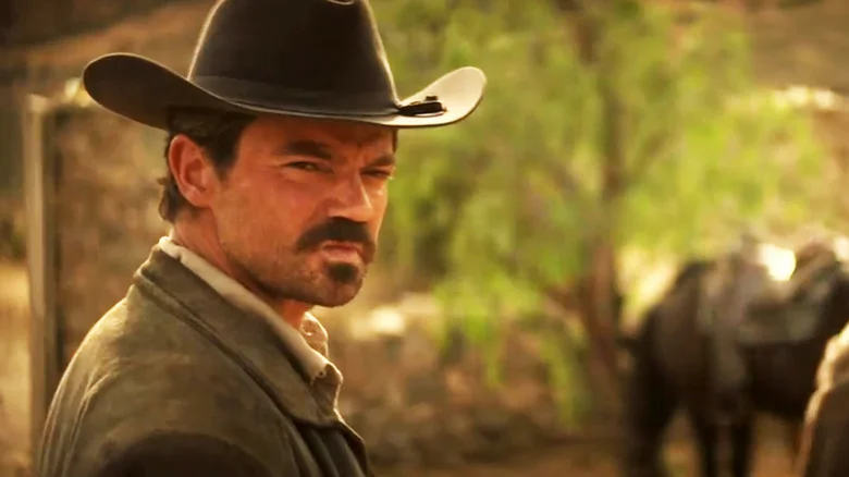 Dominic Cooper's Arthur McCoy turns to look behind him in That Dirty Black Bag