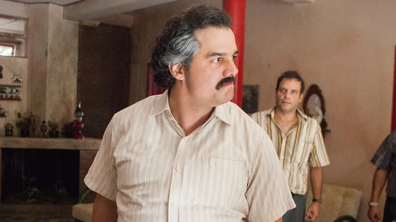 Wagner Moura as Pablo Escobar looking angry with his mustache in Narcos