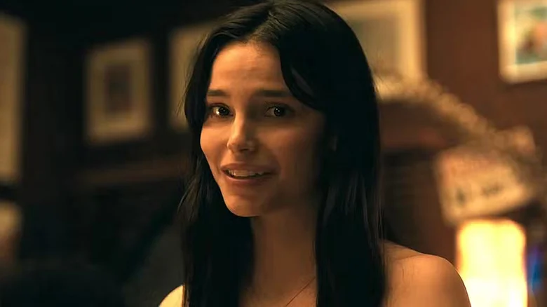 Inde Navarrette smiling unsettlingly as Nikki in Obsession