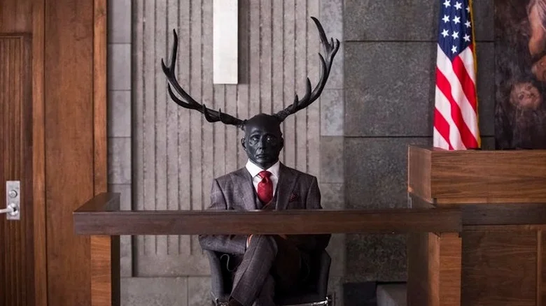 Hannibal Lecter as Wendigo sitting in courtroom in Hannibal