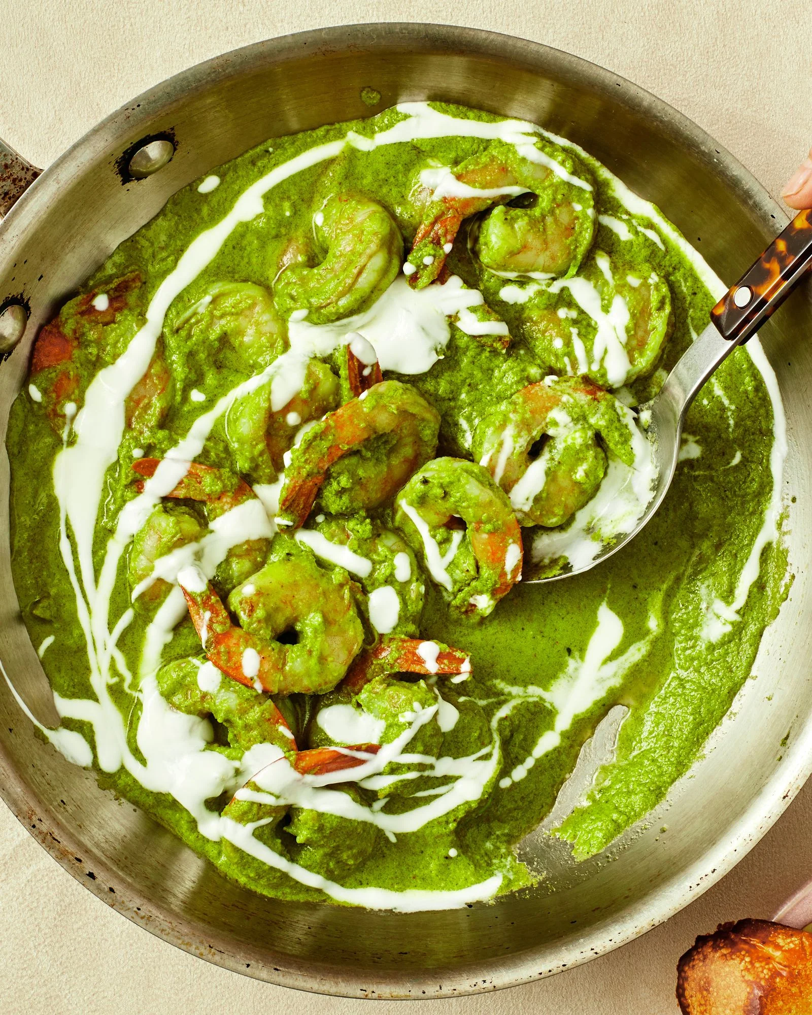 overhead view of Green Shrimp in a pan and Grilled Bread to the side in a bowl