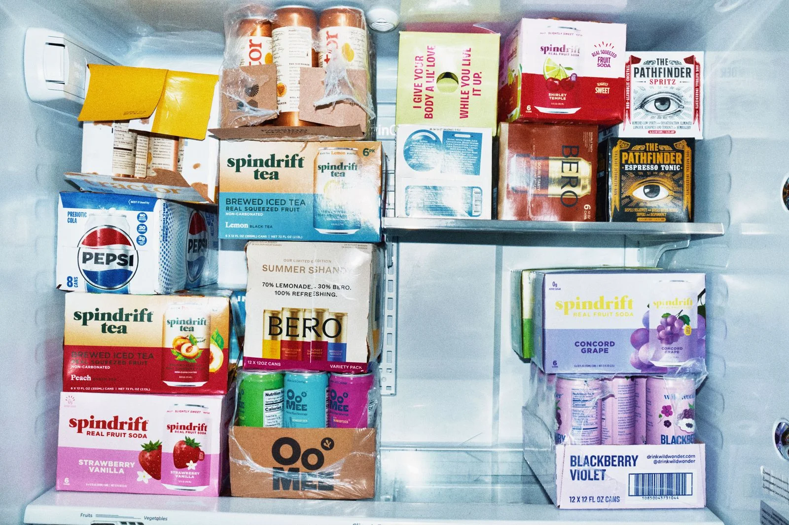 Stacks of cans of carbonated beverages in one of the Test Kitchen refrigerators.