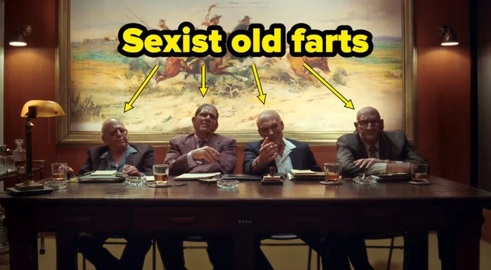 Four men in suits sit judgmentally at a table labeled "Sexist old farts"