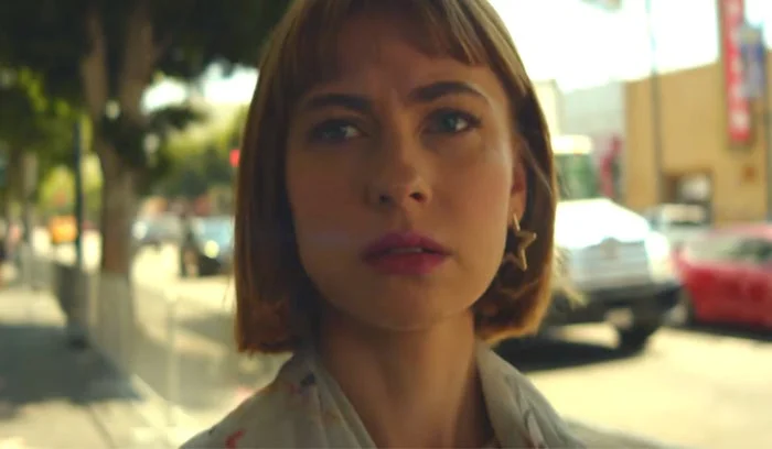 Frankie June with a thoughtful expression in her music video for "Hollywood (2016)"