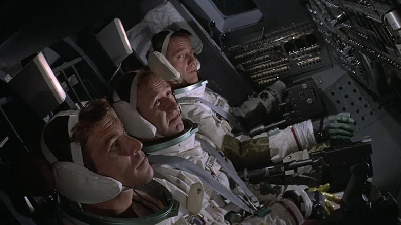 Richard Crenna's Jim Pruett,  Gene Hackman's Buzz Lloyd, and James Franciscus' Clayton Stone sit in the cockpit of their spacecraft in Marooned