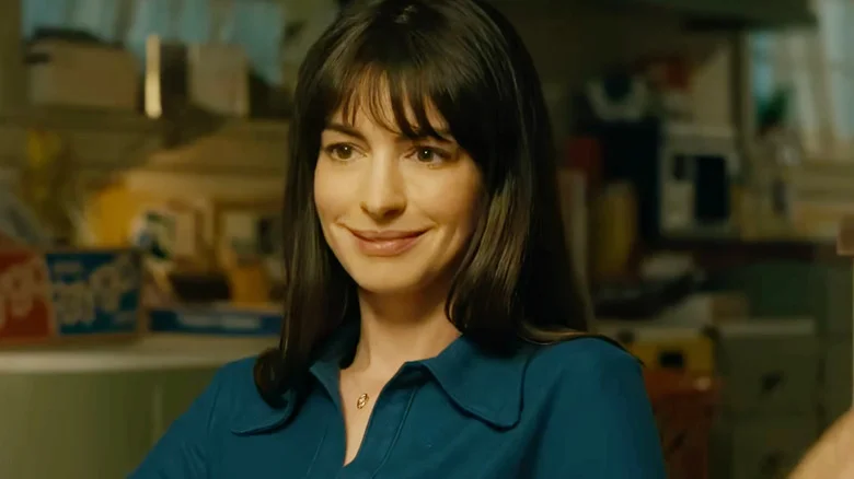 Denise Platt smiling at a kitchen table in The End of Oak Street