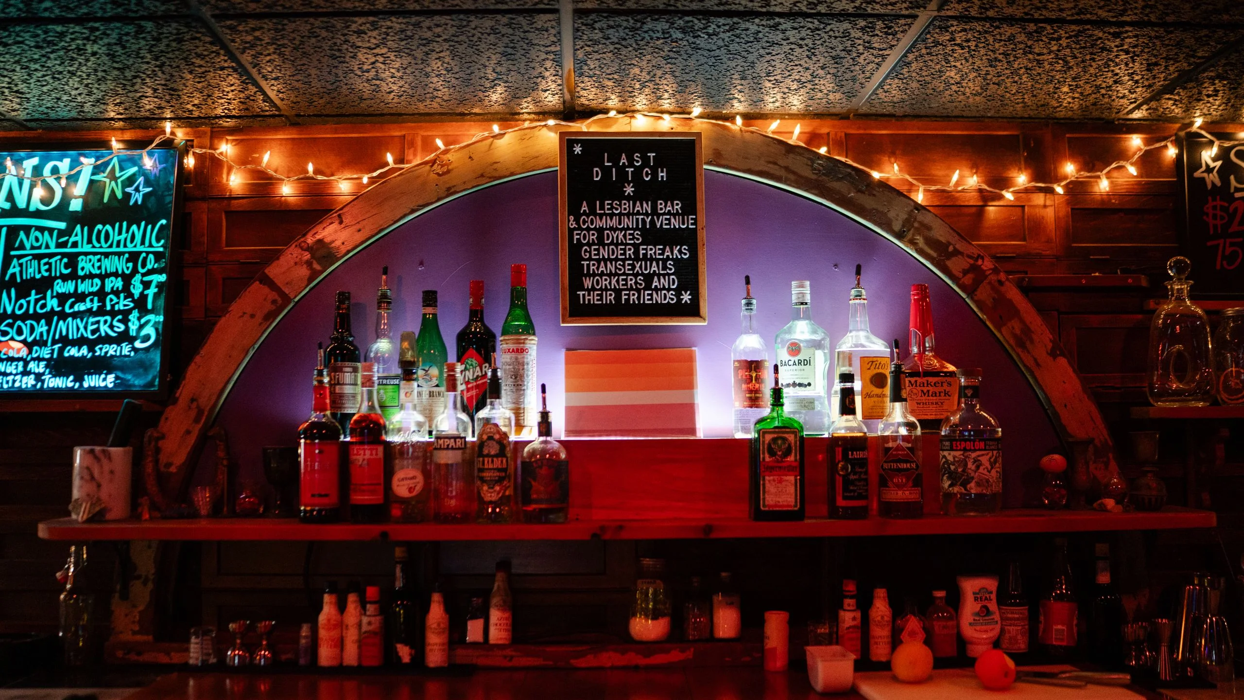 Inside of bar with string lights along the room corners
