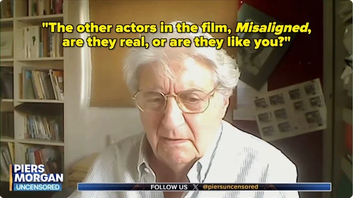 An older person with glasses in a room with books and photos in the background, on the show "Piers Morgan Uncensored."