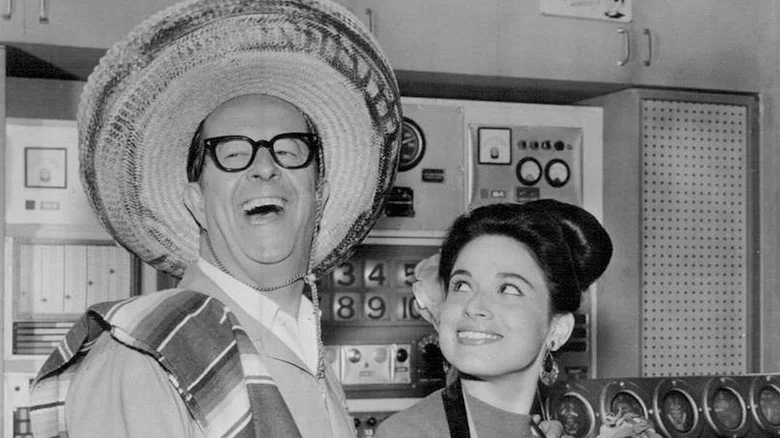 Phil Silvers sports a sombrero as Harry Grafton while celebrating Mexico Day with Mina Martinez as Mother in The New Phil Silvers Show