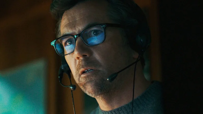 Patrick Brammall's Ian Ridley looks worried as he wears a headset in Last Seen