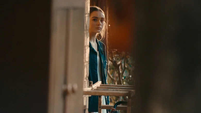 Chloe Jean Lourdes's Sarah Reid looks out from behind a wall in Last Seen