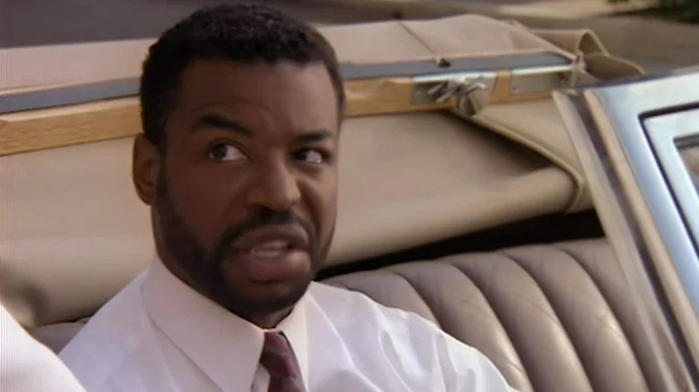 The Boss looking irritated in a car in Deadly Games