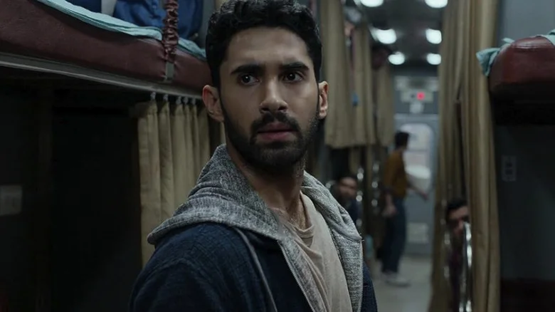 Lakshya as Captain Amrit Rathod looking concerned on a train in Kill