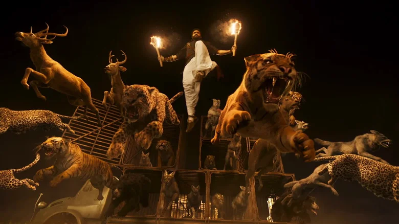 N. T. Rama Rao Jr. as Ram letting the animals loose at the manor in RRR