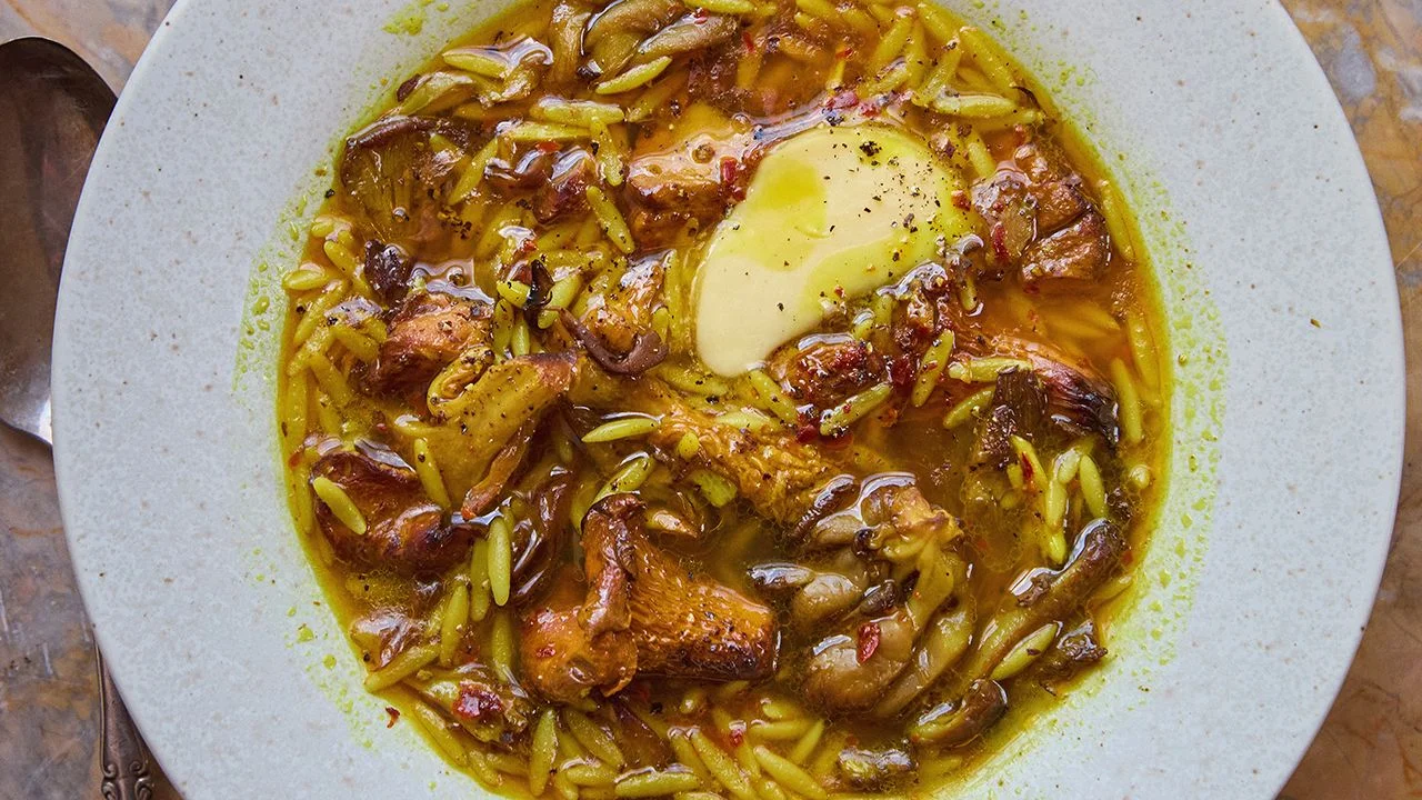 Golden mushroom soup in a white bowl