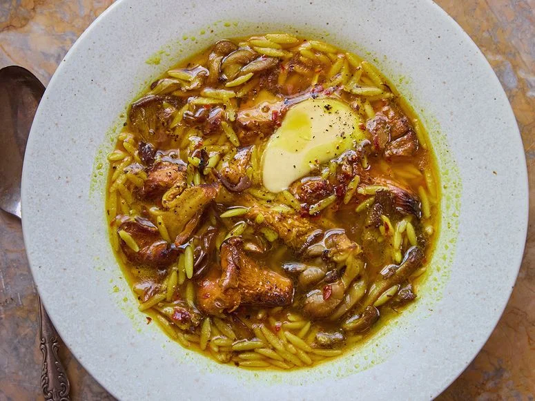 Golden mushroom soup in a white bowl