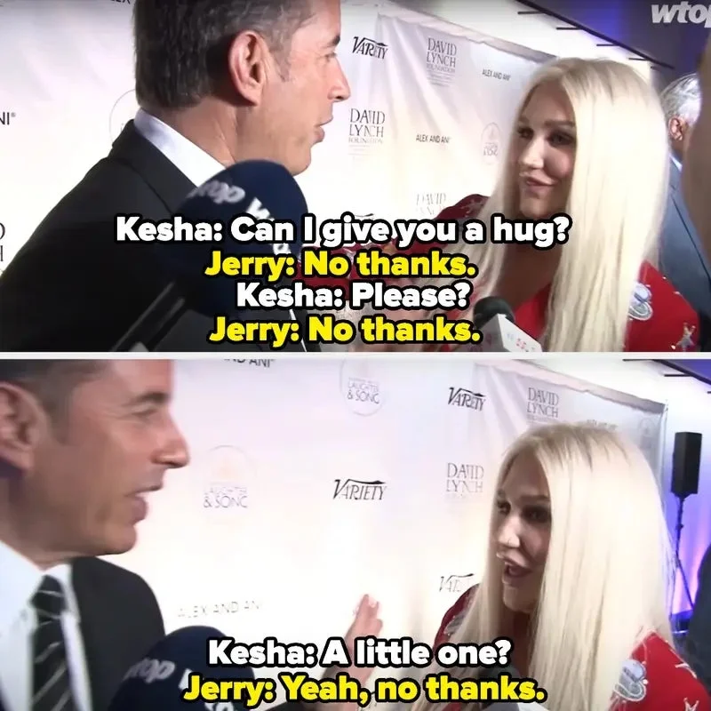 Kesha asks for a hug from Jerry on a red carpet. Jerry politely declines multiple times
