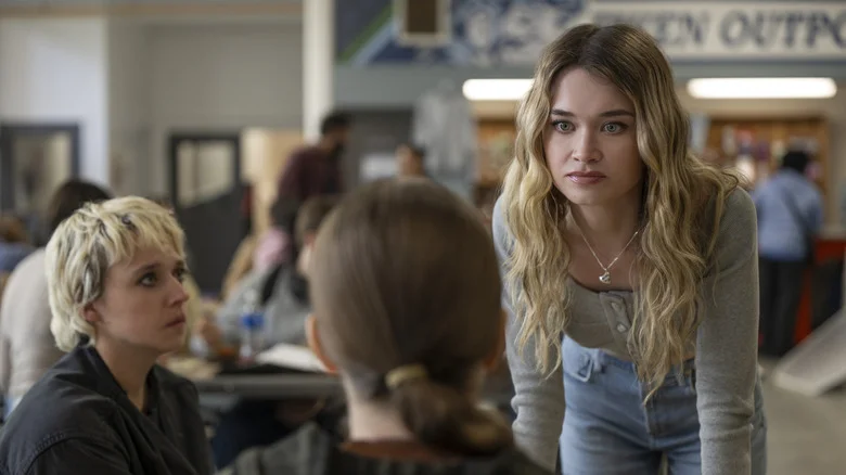 Chris looks at Carrie in the cafeteria in Carrie (2026)