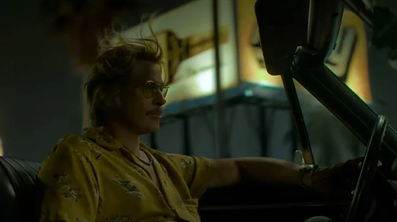 Cliff Booth driving in a convertable in The Further Mid-Adventures of Cliff Booth