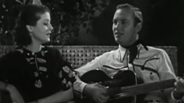 Mary Ann Lee and Gene Autry sitting together in Oh, Susanna!
