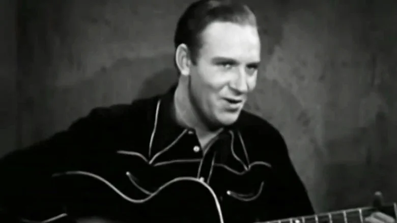 Gene Autry playing the guitar in Oh, Susanna!